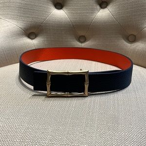 - J McLaughlin reversible belt with gold colored buckle.